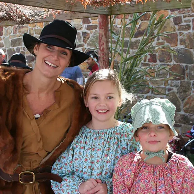 Woman and girls in pioneer clothing