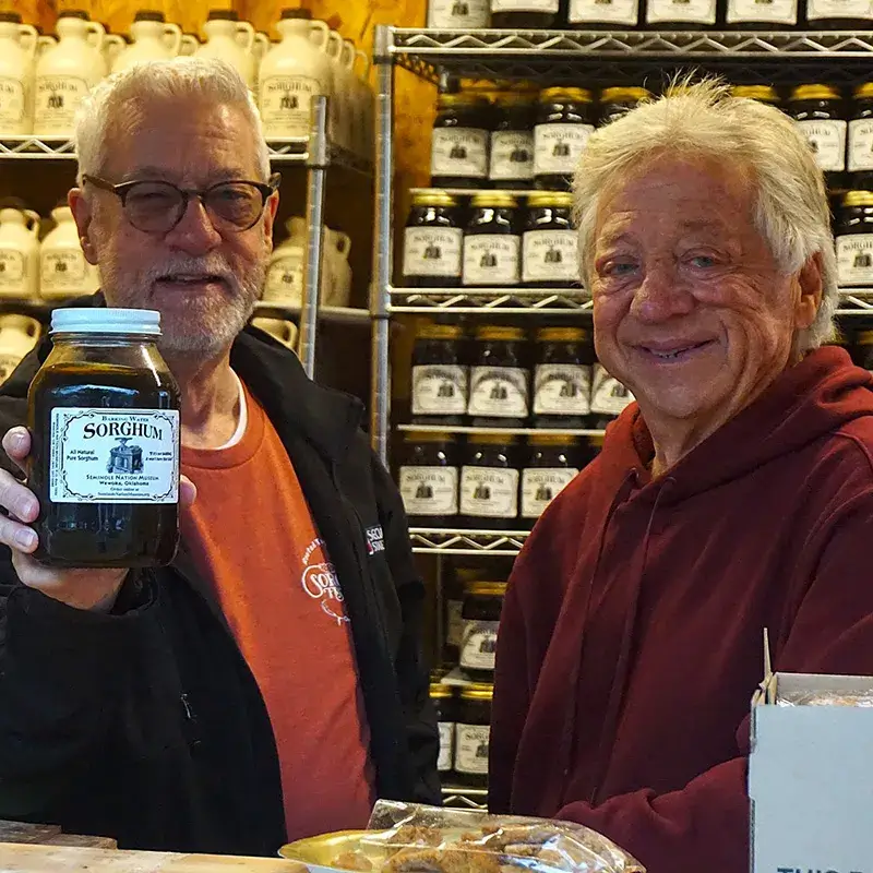 Men with sorghum products