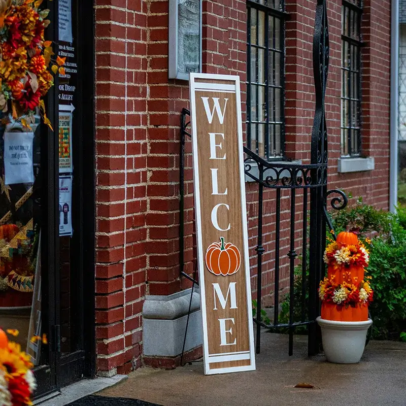 Welcome sign with fall decor